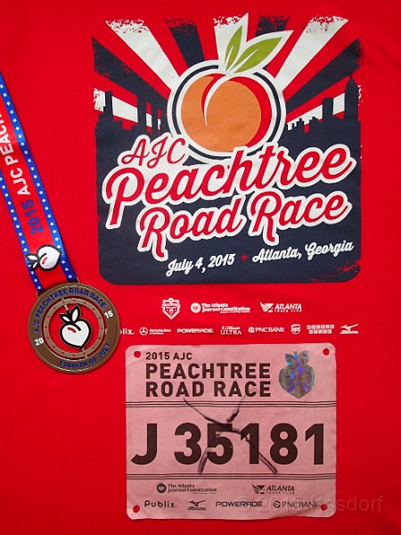 2015-07-08 2015 Peachtree 10K Awards 002.JPG - A bit different, everyone gets a medal, and only finishers get a shirt.